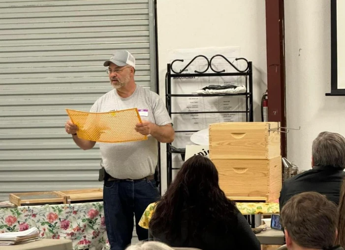 TLC Apiary owner Tracy presenting in a group beekeeping mentoring session.